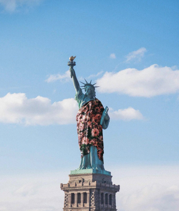 the statue of liberty with a floral blanket